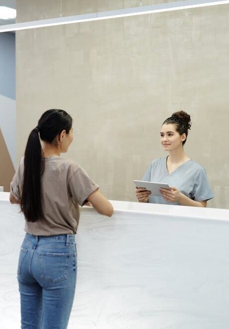 Smiling worker holding laundry